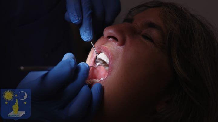 dentist placing a dental implant