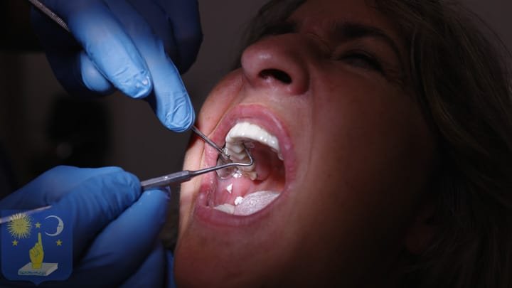 dentist places a dental implant 